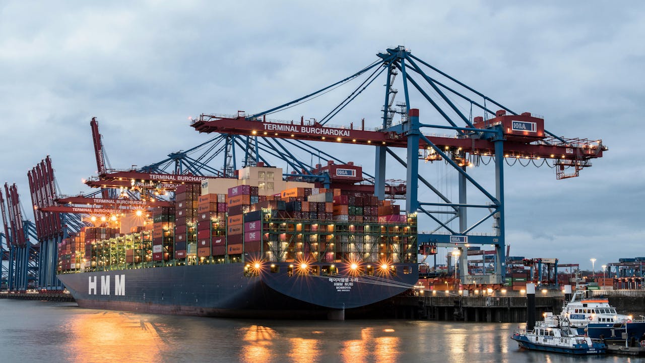 Container ship in the Port of Hamburg at Terminal Burchardkai, showcasing global trade.